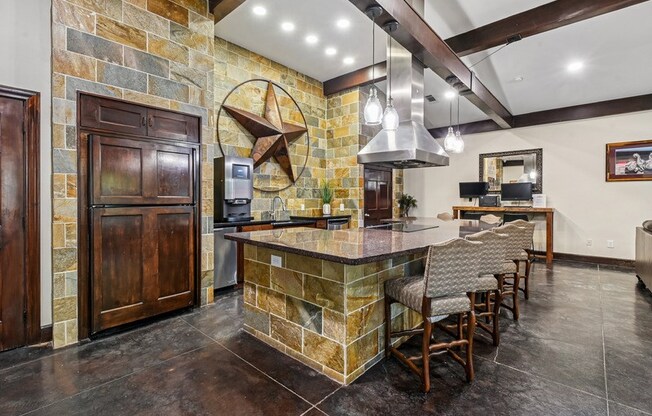 A kitchen with a stone counter and a wooden door. at The Canyons Apartments, Fort Worth, TX, 76116