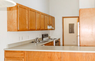 Kitchen area with lots of storage space at willow crossings apartments