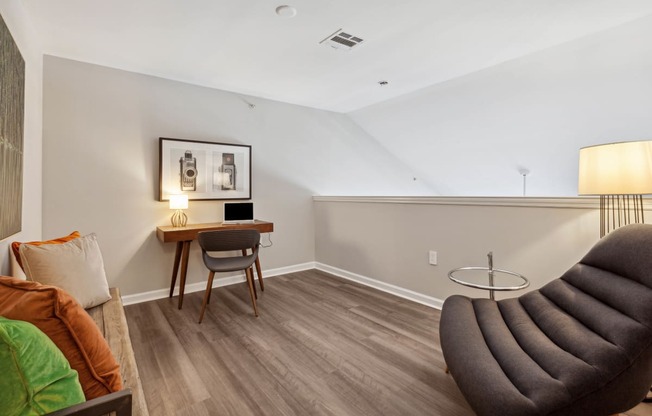 a bedroom with a desk and chair in a 555 waverly unit at Metro 303, Hempstead