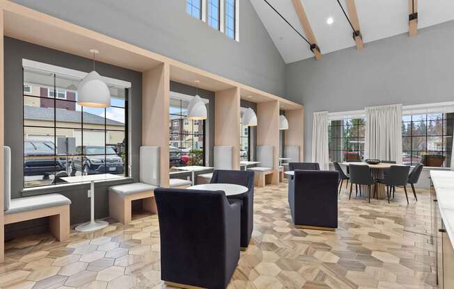 A modern interior with a black chair in the foreground.