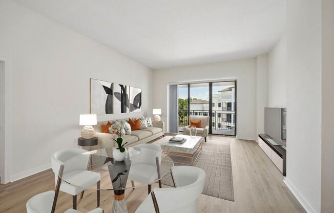 a living room with a couch and a glass table