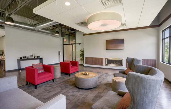 A modern living room with a fireplace and comfortable seating.