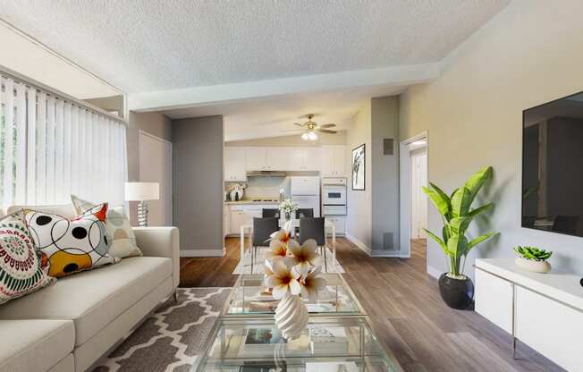 a living room with a couch and a glass table