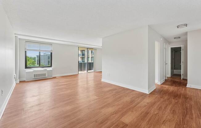 A room with wooden floors and white walls.