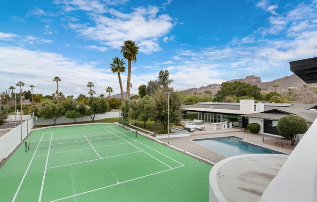 Mid-century modern home in Paradise Valley with private Pickleball court & 3 story guest home