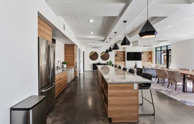 a large kitchen with a large island and a dining room