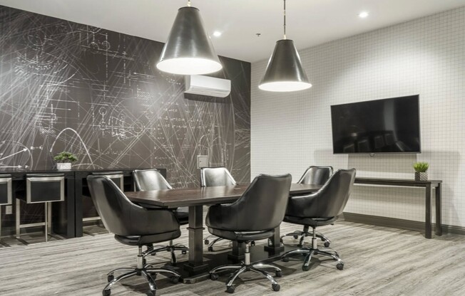 Elevate your workdays in the stylish conference room at Flats on Archer. With modern design and ample amenities, it's perfect for collaboration or video calls. Ready to take your productivity to the next level? Schedule a visit today!