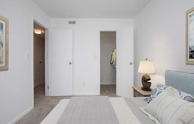 a bedroom with a bed and a closet