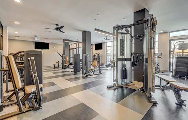 a gym with weights machines and other exercise equipment