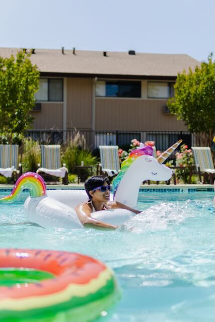 A resident enjoys the pool at Cranbrook.