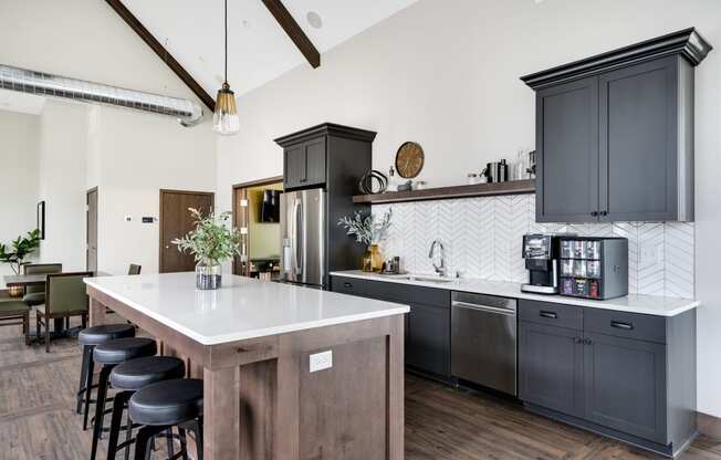 Clubhouse Kitchen with Large Kitchen Island and Bar Stool Seating