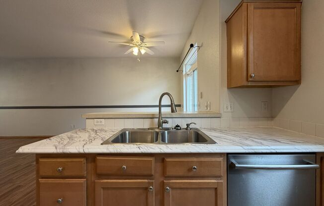 Bright Beaverton Townhome with Spacious Living Areas, Decorative Fireplace & Functional Kitchen