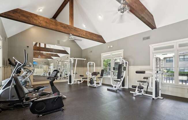 A gym with a variety of exercise equipment.