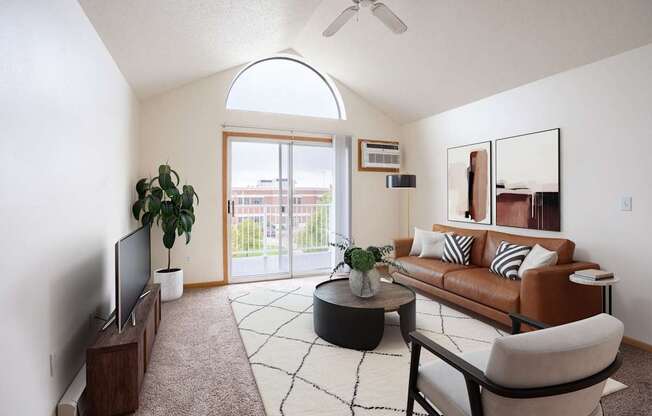 A living room with a brown couch, a television, and a plant. Fargo, ND Summit Point Apartments