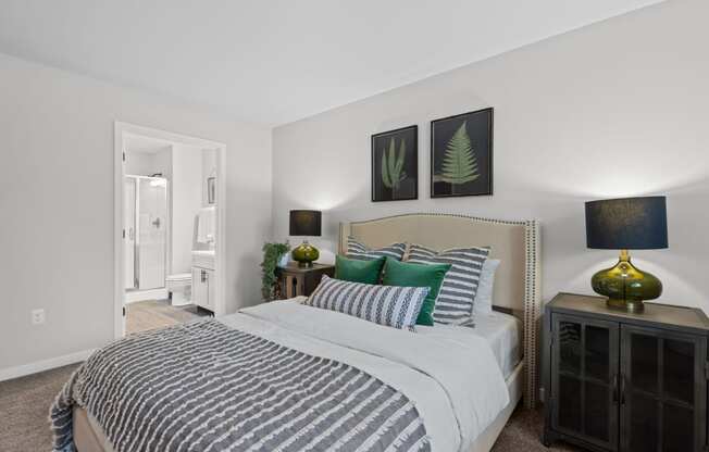 a bedroom with a large bed in a 555 waverly unit