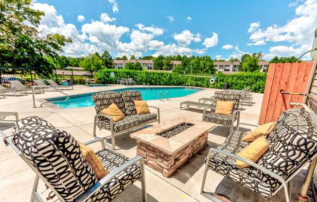 Pool area with chairs and a firepit  at Union Heights Apartments, Colorado Springs, CO