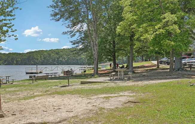 Sweetwater creek state park with a lake, picnic tables, and trees.