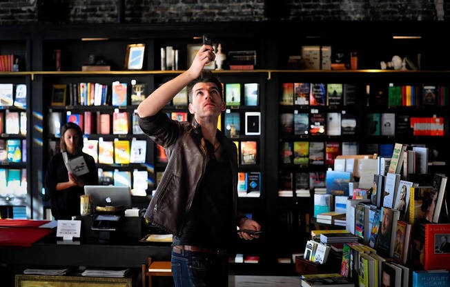 Man Standing Inside Book Store