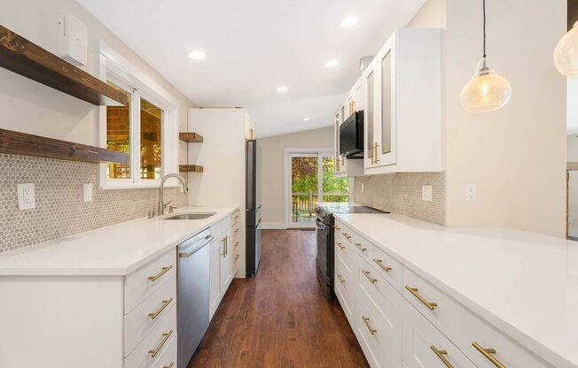 Completely Remodeled Kenmore Home with Two-Car attached Garage and Fenced Backyard!