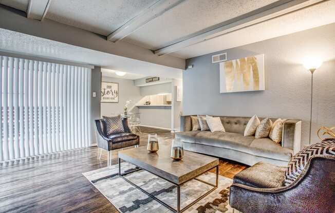 a living room with a couch coffee table and chairs