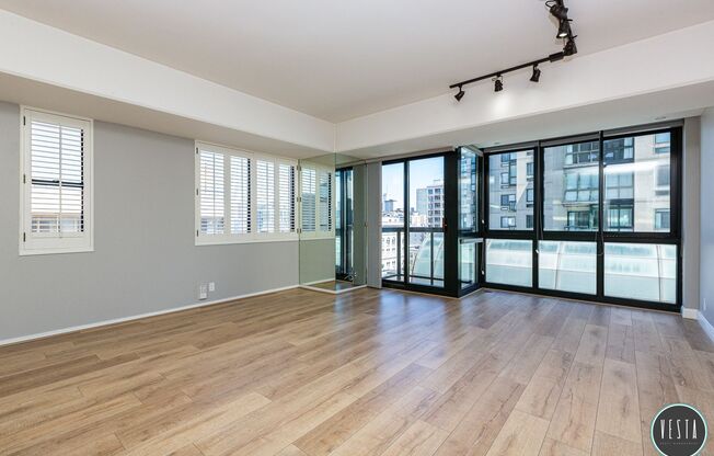 CATHEDRAL HILL: LIGHT FILLED CONDO IN FULL-SERVICE BUILDING W/ IN-UNIT WASHER/DRYER & PARKING INCLUDED