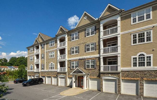 a large apartment building with a parking lot