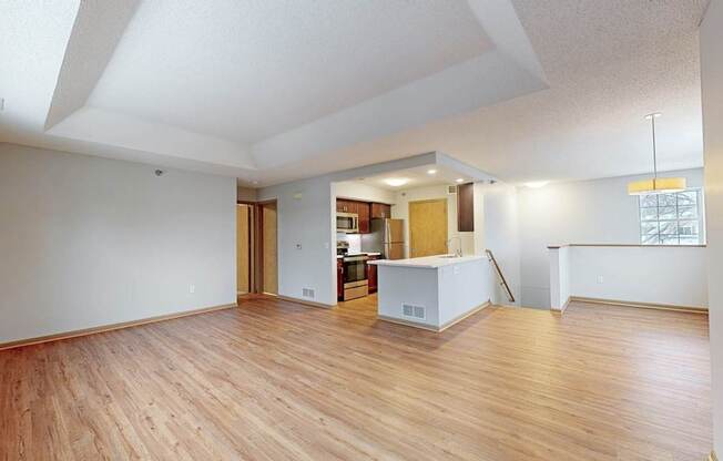 A room with wooden floors and white walls.