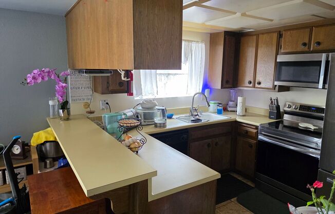 Spacious coastal close 2 bedroom condo with a detached 2 car garage