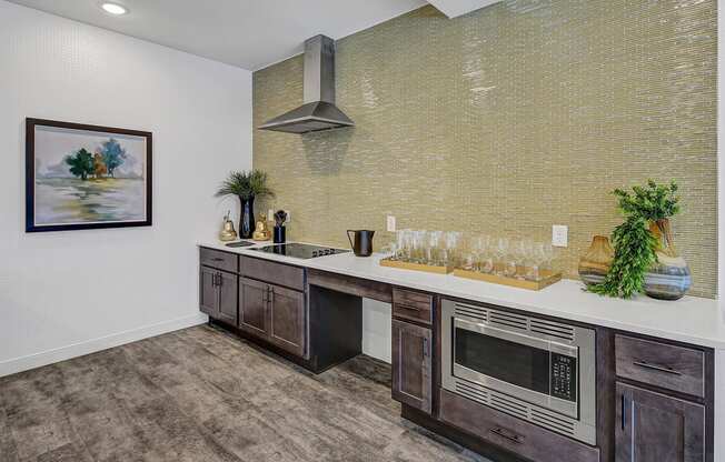 a kitchen with a counter top and a microwave