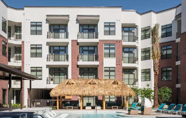 exterior view and swimming pool at Tinsley on the Park apartments