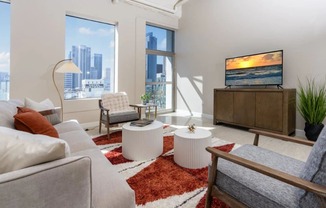 a living room with a couch and a tv