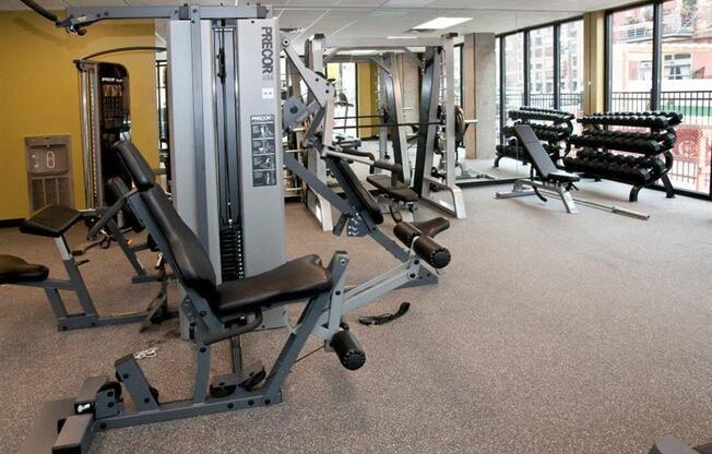 A gym with a variety of equipment including a leg press machine.