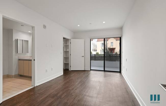 Bedroom with Walk-In Closet, Bathroom, and Balcony Access