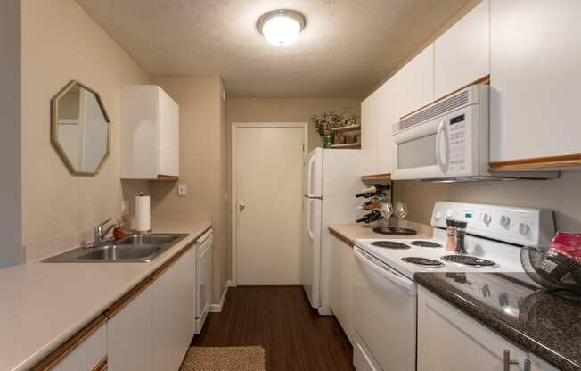 This is a photo of the kitchen of the 890 square foot 2 bedroom, 2 bath Liberty at Washington Place Apartments in in Miamisburg, Ohio in Washington Township.