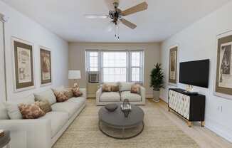 living area with sofa, coffee table, large windows, and ceiling fan at the calverton apartment building in washington dc