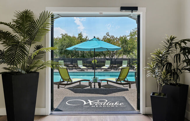 Apartments Lake Oswego for Rent - Westlake Meadows - An Exterior Shot Of The Swimming Pool Surrounded By Lounge Chairs And Umbrellas