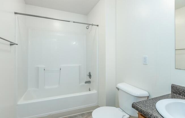 a room with a sink and a shower