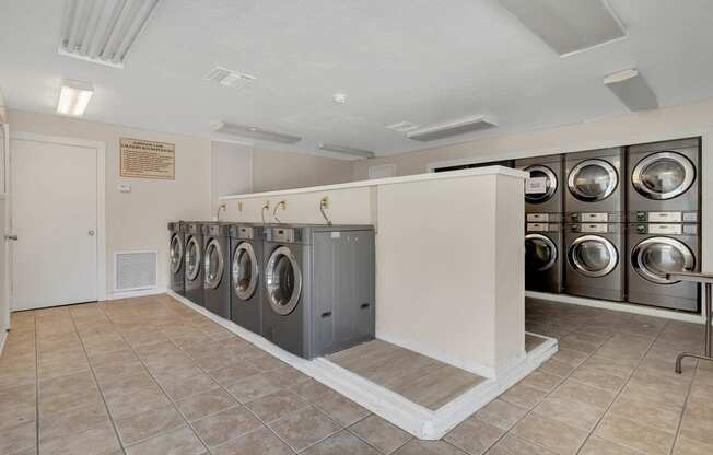 photo of washer and dryers in a laundry room