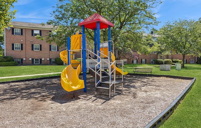 a playground with a swing set and slides