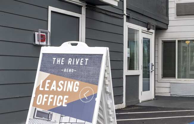 the rivet leasing office sign in front of a building