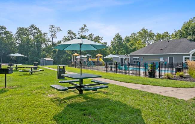 our apartments have a picnic area with tables and umbrellas