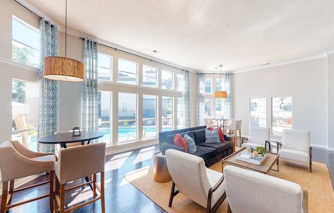 a living room with a couch and a table with chairs