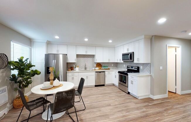 Sunnyside - RENOVATED! Coastal, two bedroom apartment home with in-unit W/D, A/C, and underground parking