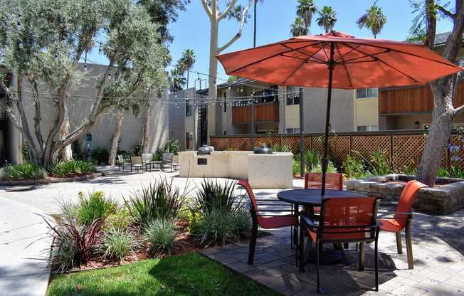 BBQ area with table, chairs and umbrella available for all tenants to use