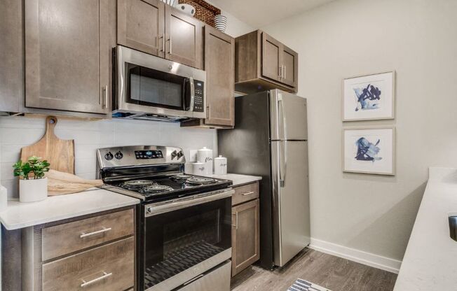 Kitchen with quartz countertops and stainless steel appliances