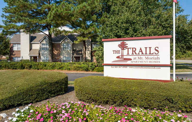 the trails at the north apartments sign at the trails in the month of april