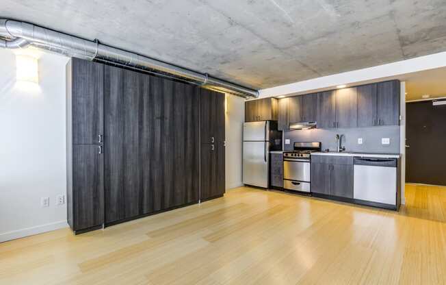 Studio layout with kitchen with stainless steel appliances
