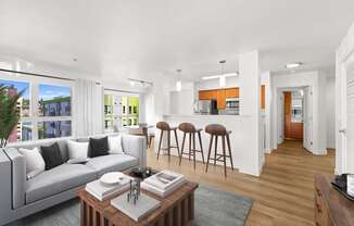 A modern living room with a grey sofa and a coffee table.