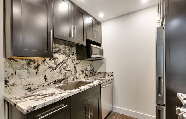 Glass Tiled Kitchen Backsplash at Woodcliff Apartments, Los Angeles, 90034