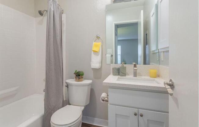 a bathroom with a sink toilet and a mirror  at Skyline Heights LLC, Daly City, California